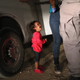 A two-year-old Honduran asylum seeker cries as her mother is searched and detained near the U.S.-Mexico border on June 12, 2018 in McAllen, Texas.